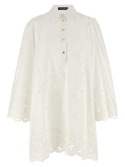 Dress by Dolce & Gabbana for women in cotton polyester white showcases a striking silhouette, elegantly detailed with a , refined , and a striking short for a striking finish.