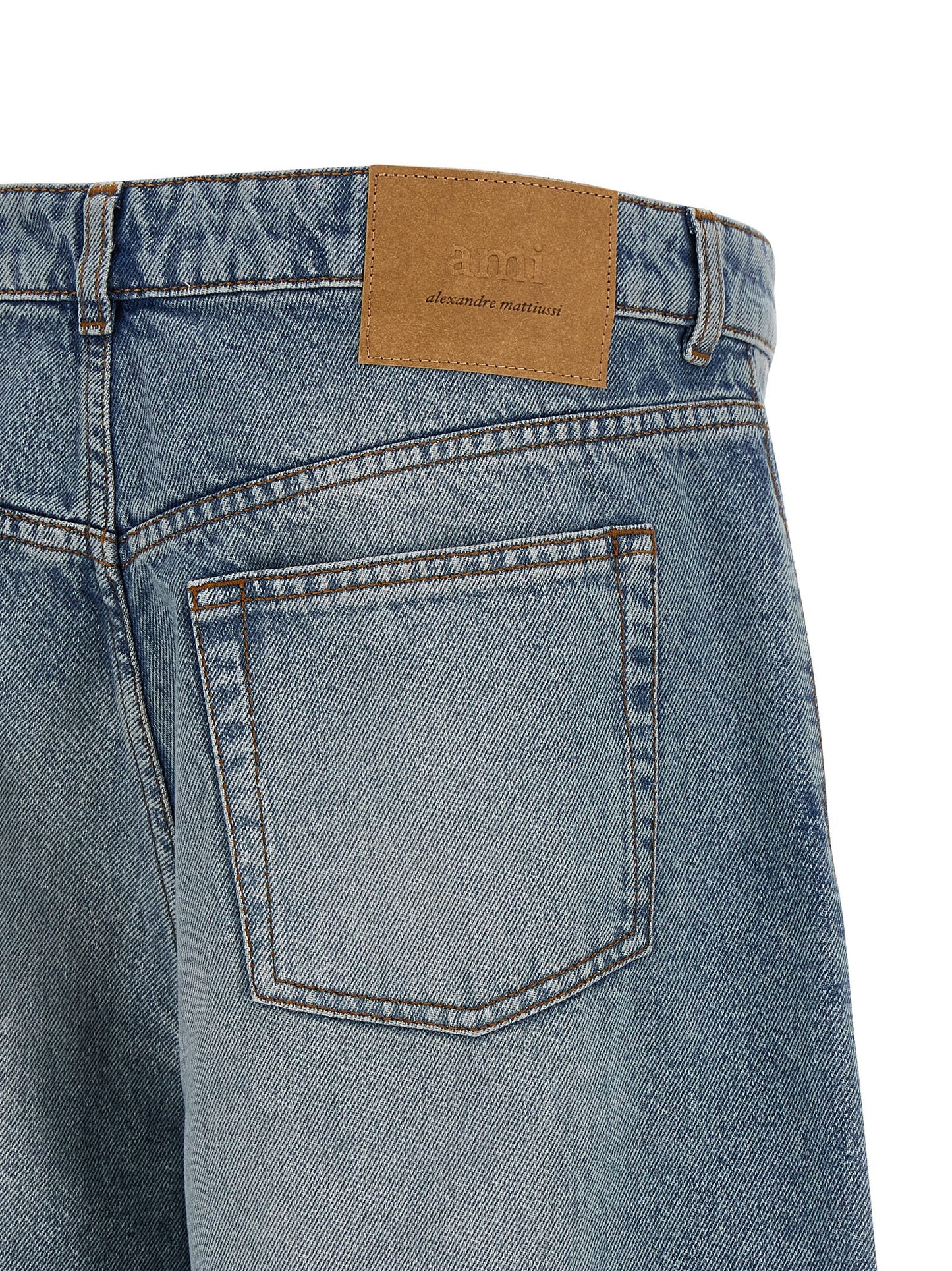 Denim Shorts by Ami Paris for men in cotton denim blue presents a contemporary silhouette, featuring a contemporary flared & wide and short with a contemporary for a sophisticated summer look.