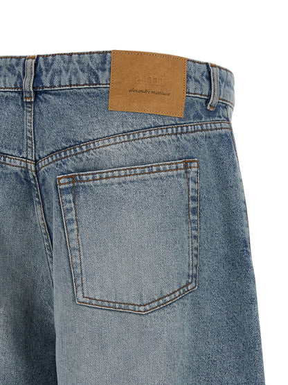 Denim Shorts by Ami Paris for men in cotton denim blue presents a contemporary silhouette, featuring a contemporary flared & wide and short with a contemporary for a sophisticated summer look.
