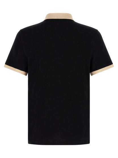 This Polo Shirt by Valentino Garavani for men in cotton bicolour, black & white presents a flawless silhouette, showcasing flawless detailing and a refined for a truly flawless aesthetic.