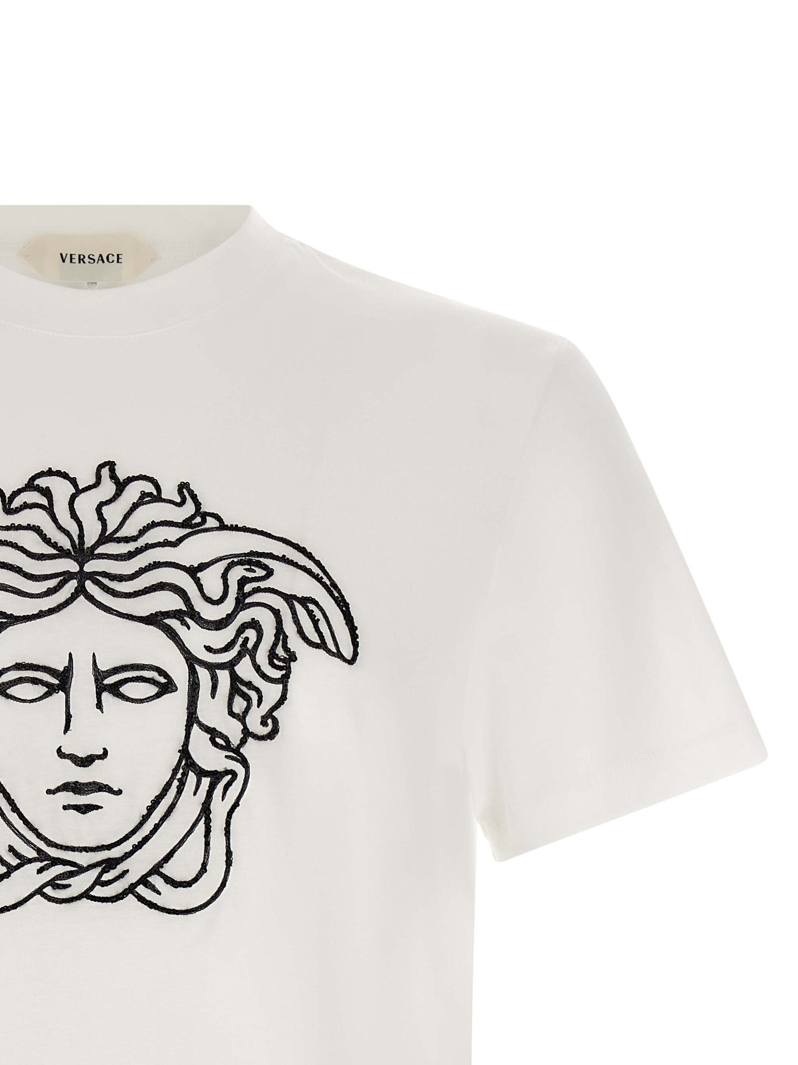 T-Shirt by Versace for men in cotton bicolour, black & white features a plush silhouette, showcasing a sophisticated crew neckline and for a truly plush finish.