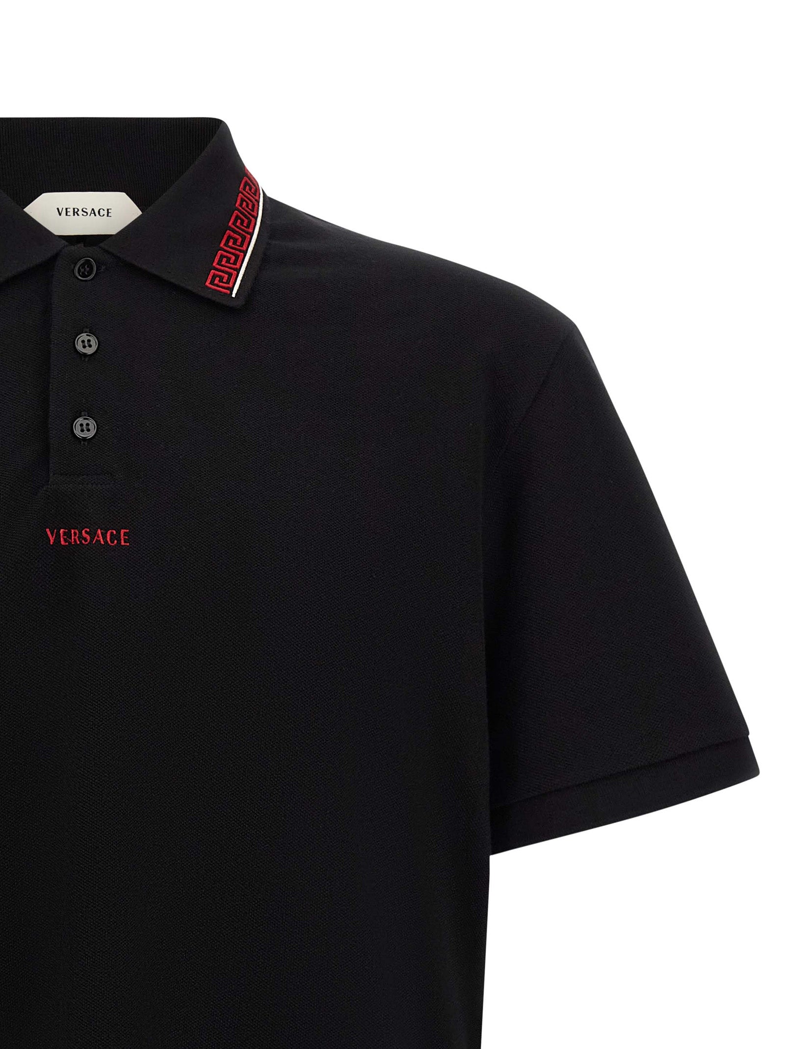 Polo Shirt by Versace for men in cotton black showcases a sharp silhouette, detailed with a refined and sharp for a sophisticated finish.