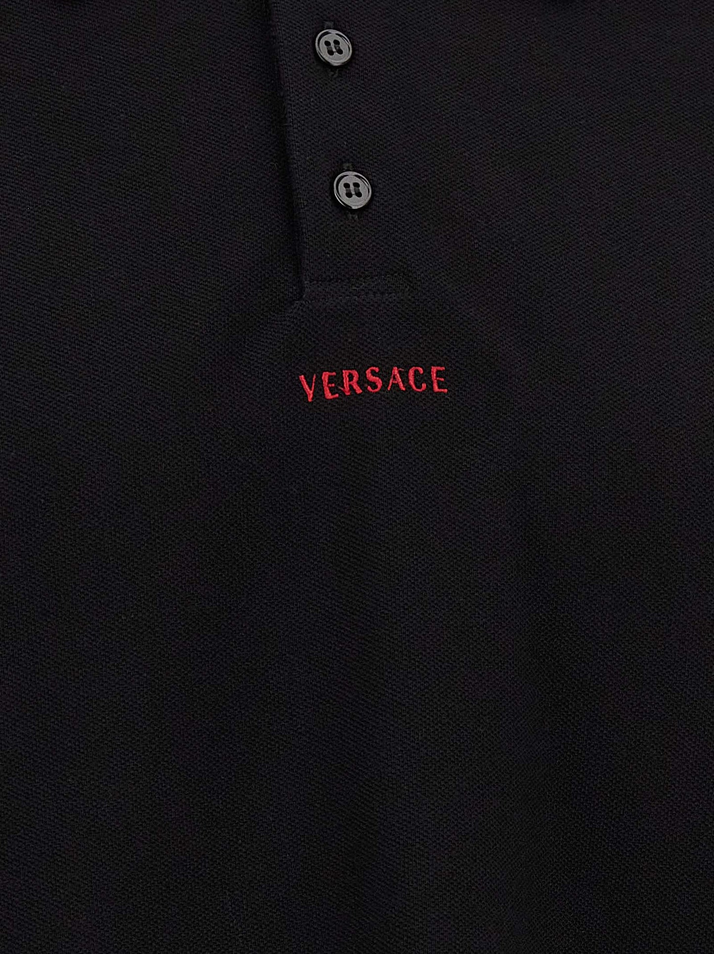 Polo Shirt by Versace for men in cotton black presents a distinguished silhouette, showcasing a sophisticated and distinguished for a truly distinguished finish.