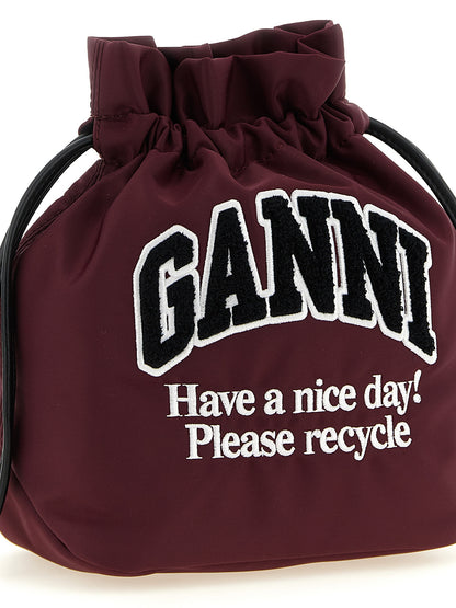 Bucket Pouch Clutch Handbag by Ganni for women in polyamide leather bordeaux & silver features a sculptural silhouette with a secure , organized , and versatile for a sculptural finish.