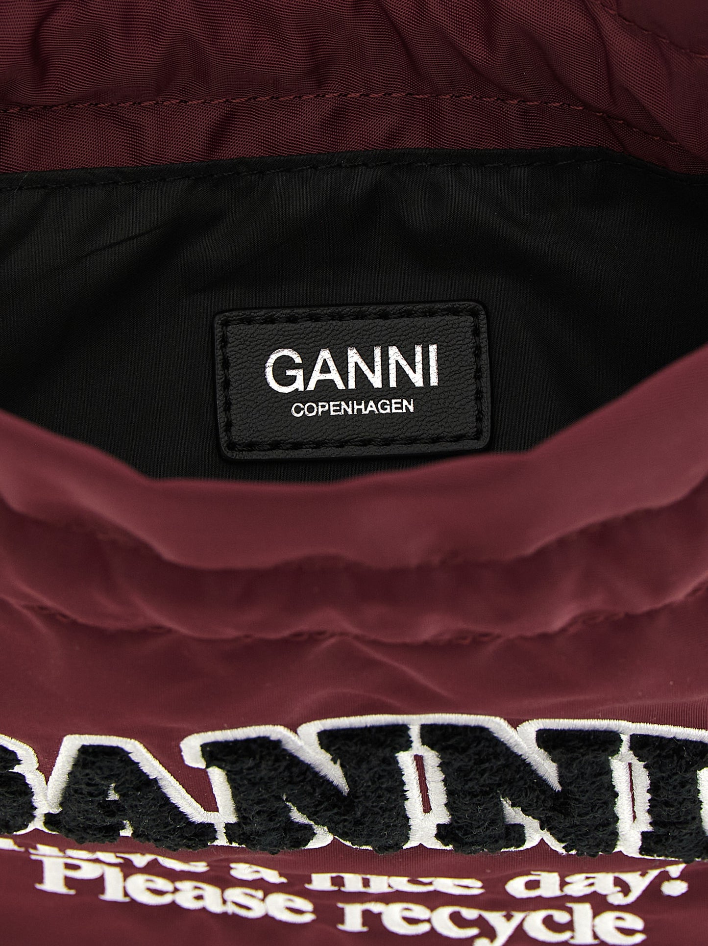 Bucket Pouch Clutch Handbag by Ganni for women in polyamide leather bordeaux & silver showcases a sculptural silhouette, featuring a secure , ample , and versatile for a sculptural finish.