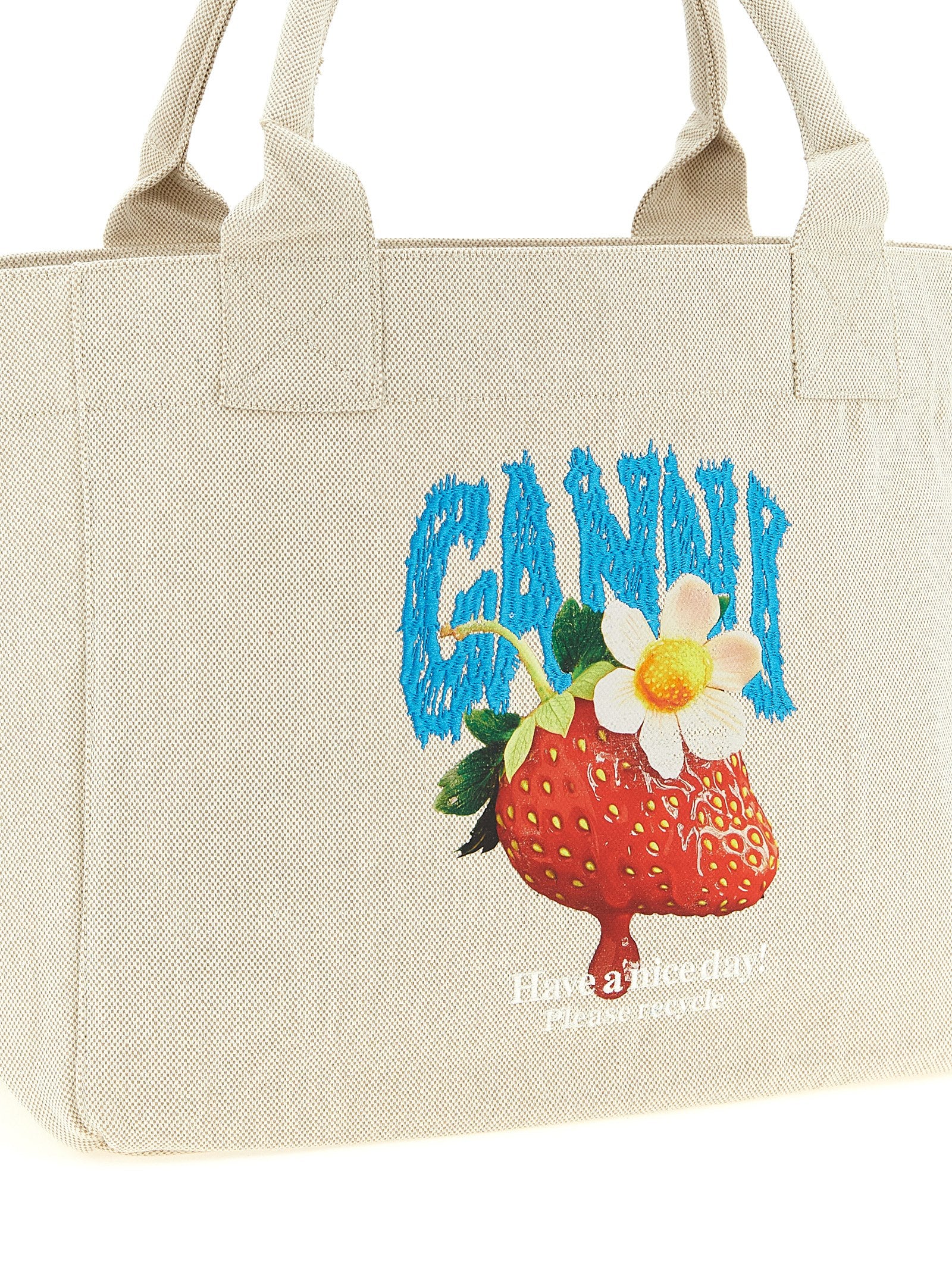 Medium Shopper Tote Bag by Ganni for women in cotton canvas beige features a distinguished Strawberry Cotton Canvas Medium Shopper Tote Bag design, complete with a secure , ample , and versatile handle for a distinguished look.