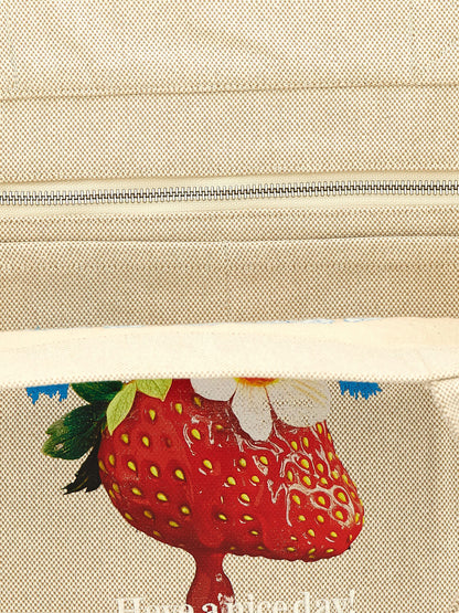 This Medium Shopper Tote Bag by Ganni for women in cotton canvas beige features an on trend Strawberry Cotton Canvas Medium Shopper Tote Bag design with a secure , ample , and on trend handle.