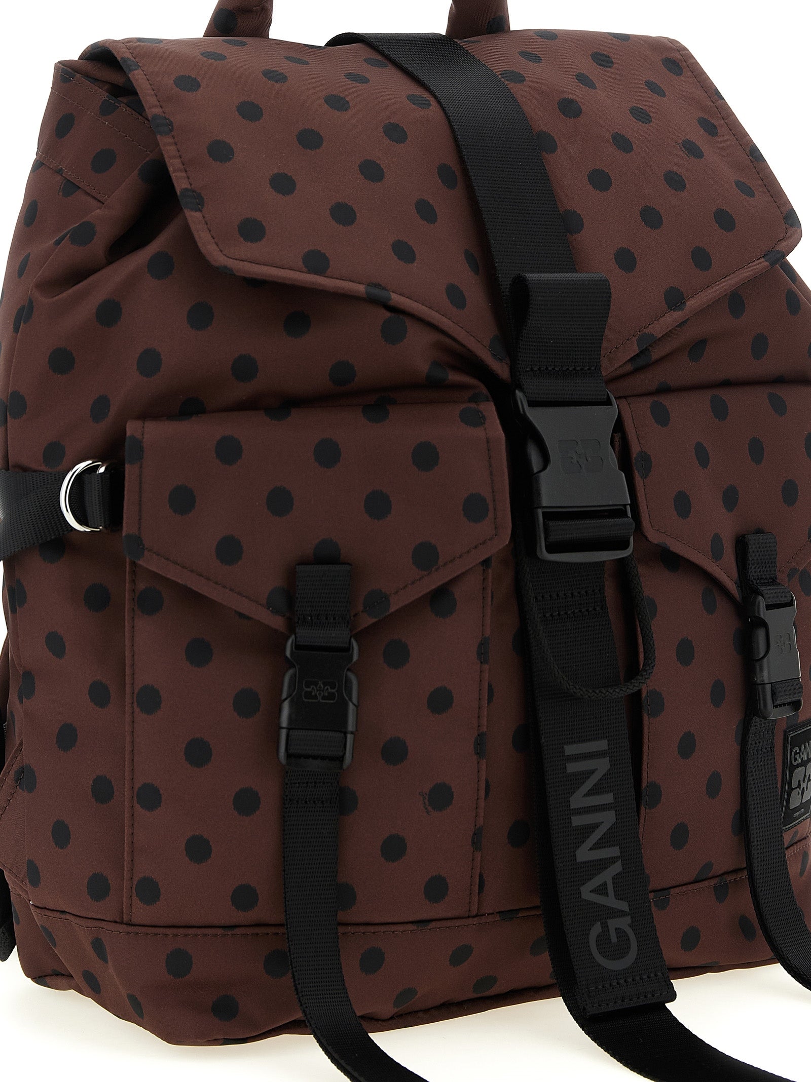 Drawstring Flap Backpack by Ganni for women in polyamide black, brown, patterned & signature features a effortlessly chic Re Tech Polyamide Drawstring Flap Backpack design, showcasing a secure flap, zipper & drawstring, ample external-pockets, and versatile backpack-strap for a effortlessly chic finish.