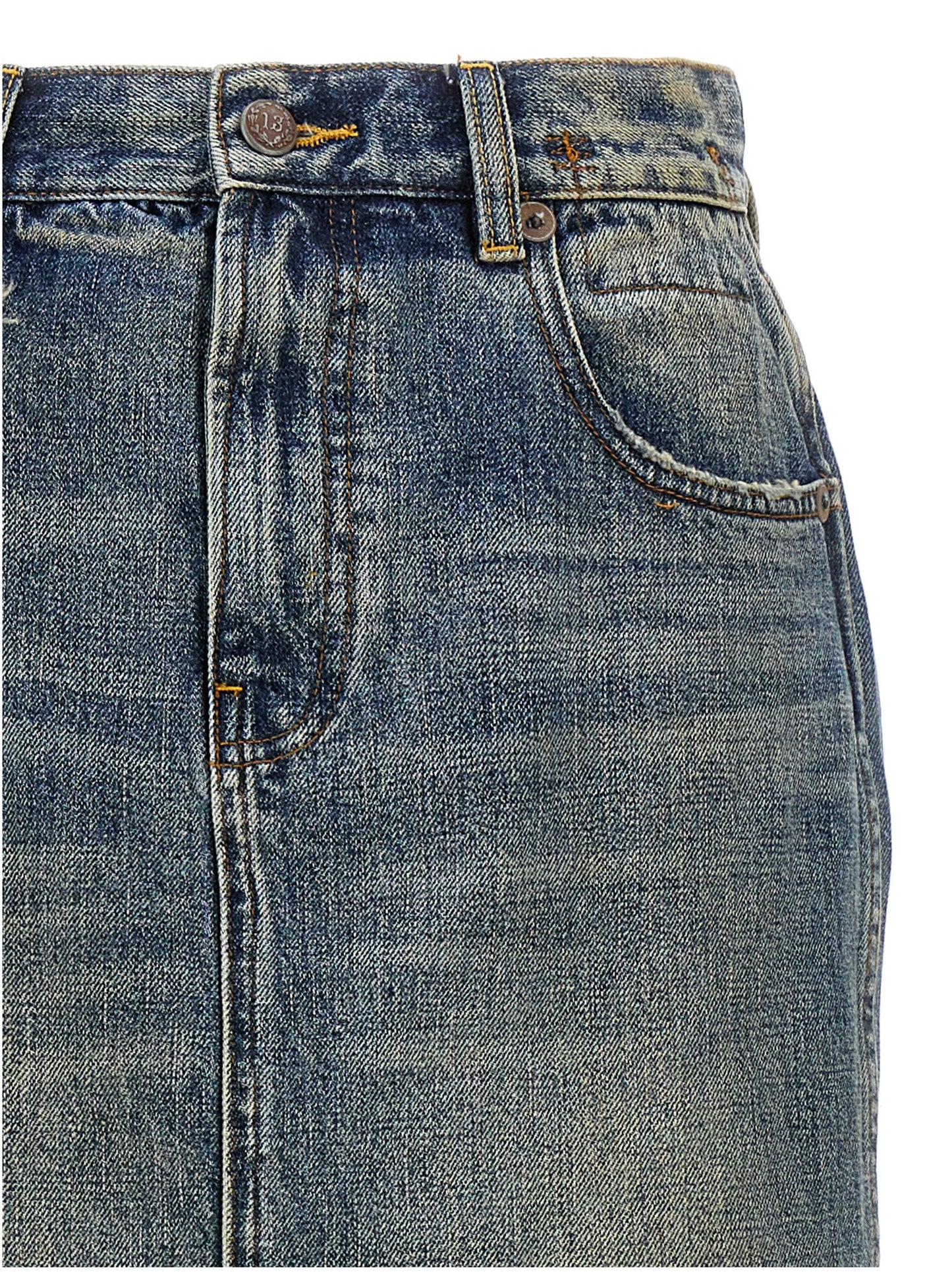 Skirt by R13 for women in cotton denim blue showcases a dramatic silhouette, artfully capturing the essence of the Devon Women's Denim Cotton Skirt in a dramatic mini cut for a refined look.