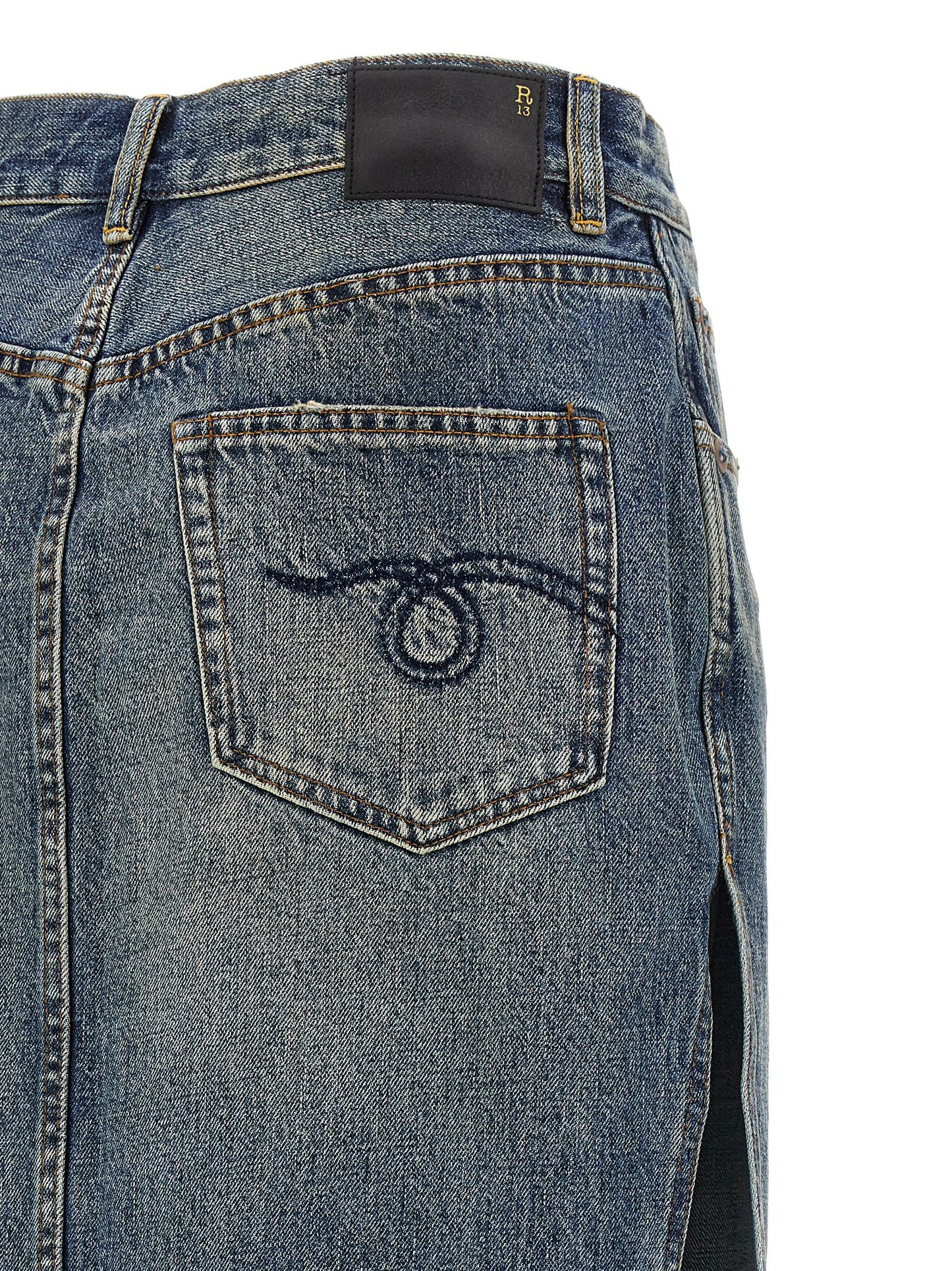 Skirt by R13 for women in cotton denim blue features an tailored silhouette, artfully capturing the essence of Devon Women's Denim Cotton Skirt in a sophisticated mini.