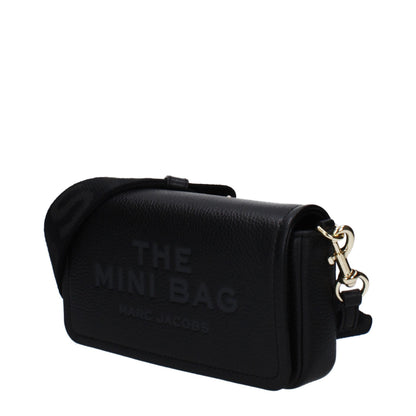 Mini Crossbody Handbag by Marc Jacobs for women in leather black features a multifaceted silhouette, showcasing a secure magnetic and multifaceted built-in-compartments & cardholder with versatile crossbody-strap, shoulder-strap & adjustable-strap for multifaceted style.