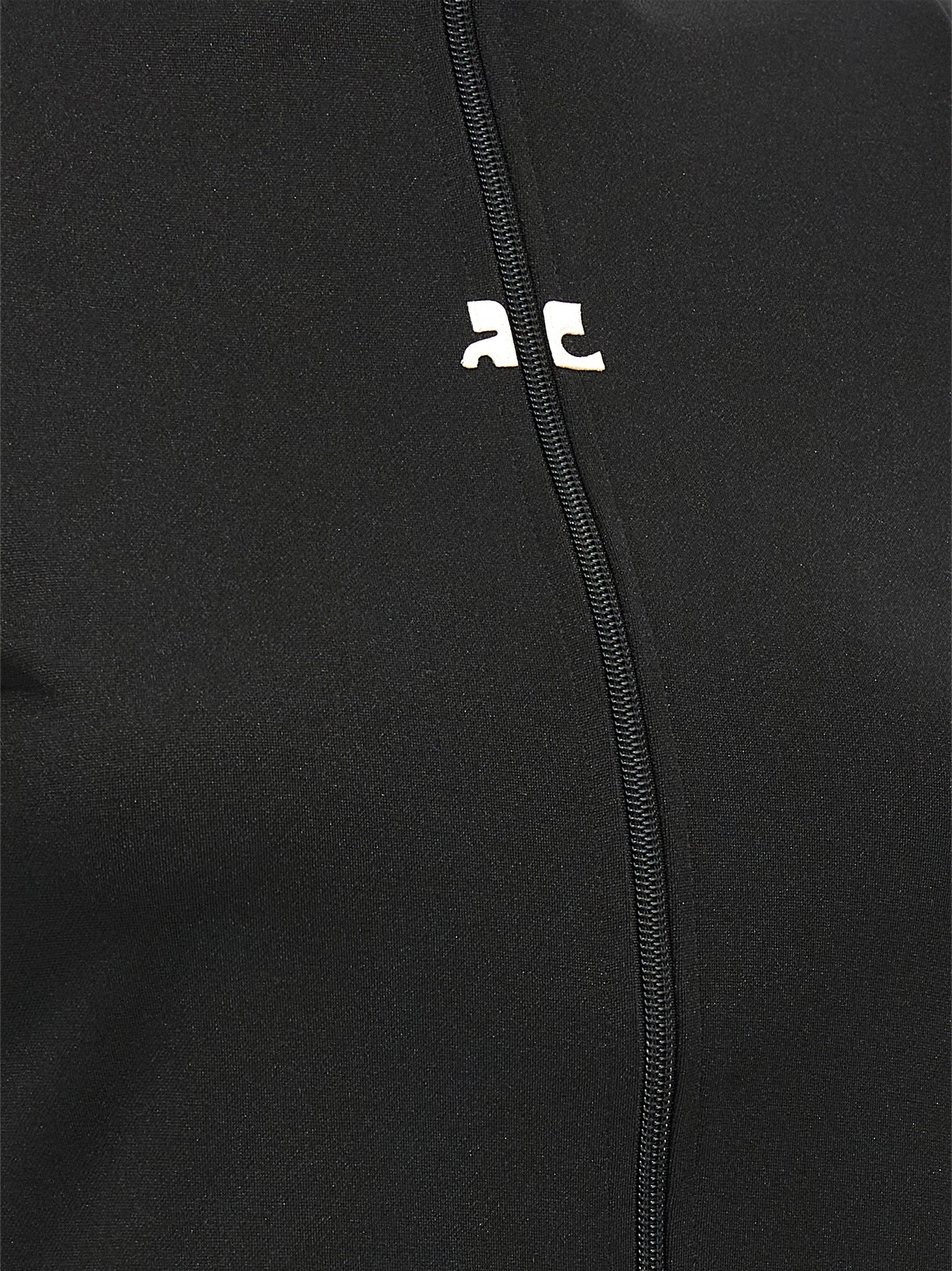 Activewear T-Shirt by Courrèges for women in polyester black features an athletic silhouette with sleeves and a neckline, enhanced by high-performance seamless.