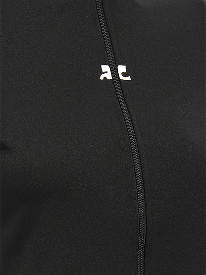 Activewear T-Shirt by Courrèges for women in polyester black features an athletic silhouette with sleeves and a neckline, enhanced by high-performance seamless.