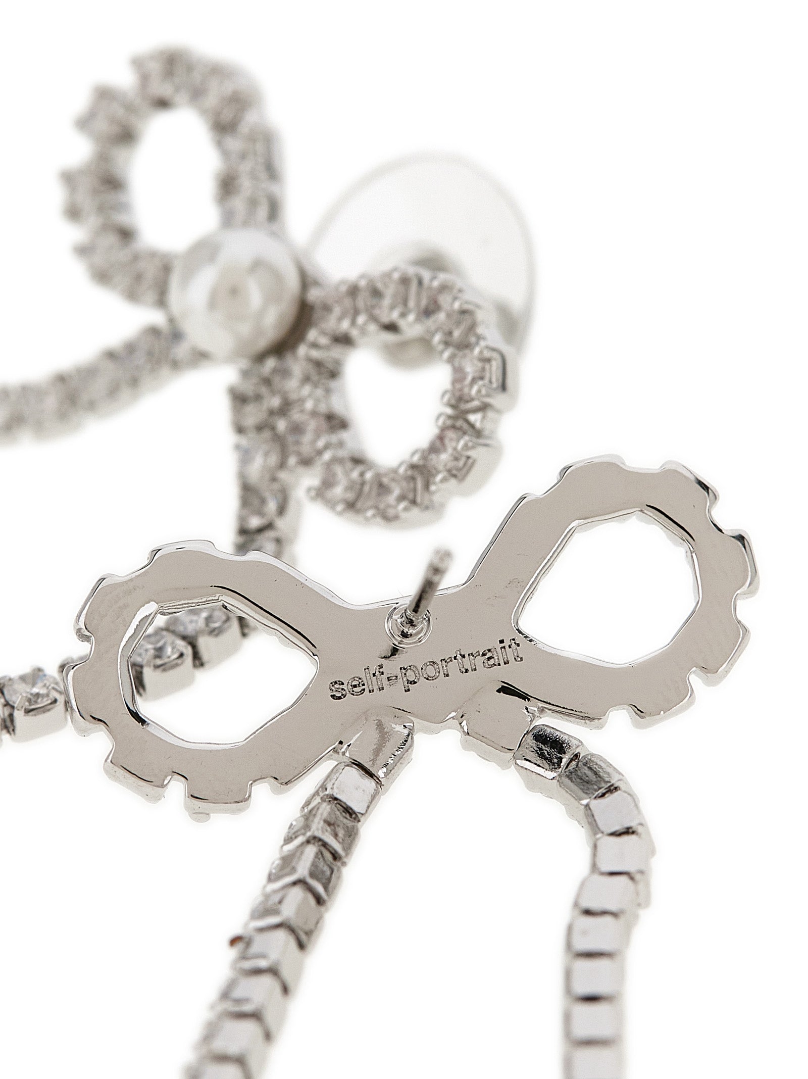 Earrings by Self-Portrait for women in suede calfskin leather copper, pearl & silver presents a resplendent silhouette, artfully capturing the essence of the Women's Silver Copper Pearls & Crystal Earrings with a resplendent for a sophisticated look.