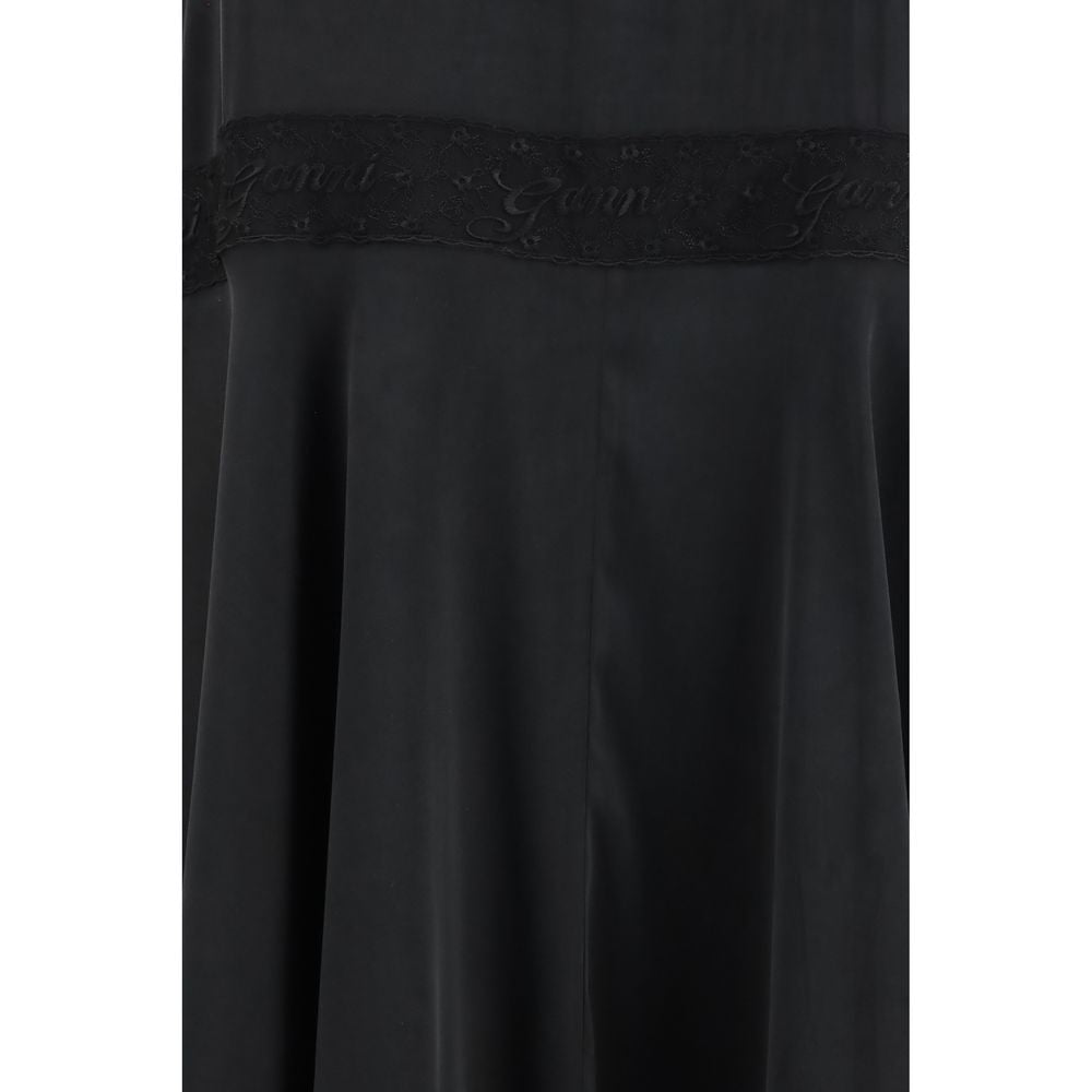 Dress by Ganni for women in viscose silk black features an cute silhouette, detailed with a and that elegantly flows into a cute maxi long.