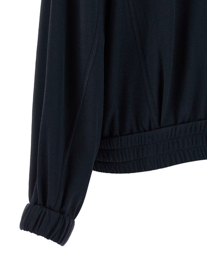 This Bomber Jacket by Brunello Cucinelli for women in silk cotton & polyamide blue exhibits a edgy silhouette, meticulously detailed with functional pockets and a edgy for a edgy finish.