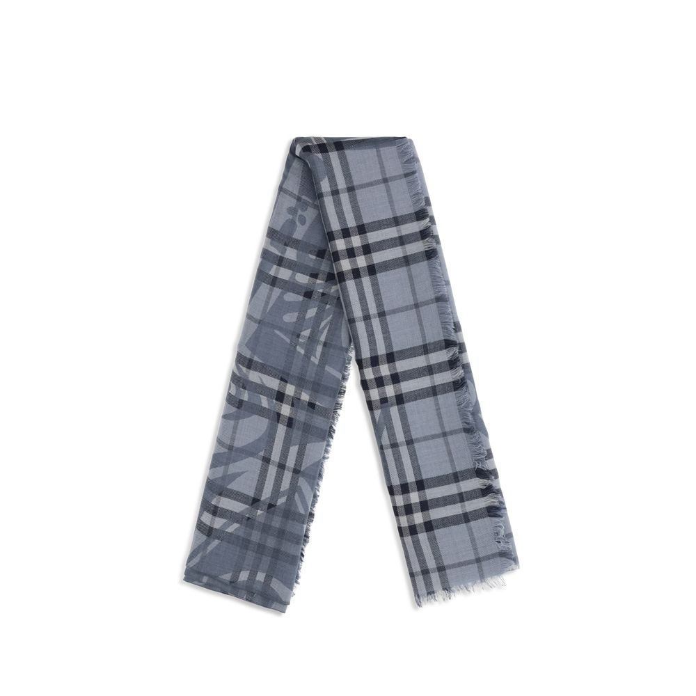 Scarf by Burberry for women in wool & silk blue & jacquard showcases a warm silhouette from the Wool & Silk Foulard Scarf collection, offering a warm drape that exudes sophisticated luxury.