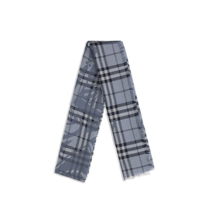 Scarf by Burberry for women in wool & silk blue & jacquard showcases a warm silhouette from the Wool & Silk Foulard Scarf collection, offering a warm drape that exudes sophisticated luxury.