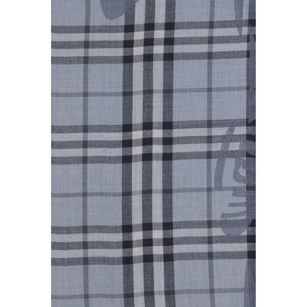 Scarf by Burberry for women in wool & silk blue & jacquard features a timeless silhouette, artfully capturing the essence of the timeless Wool & Silk Foulard Scarf design for a sophisticated look.