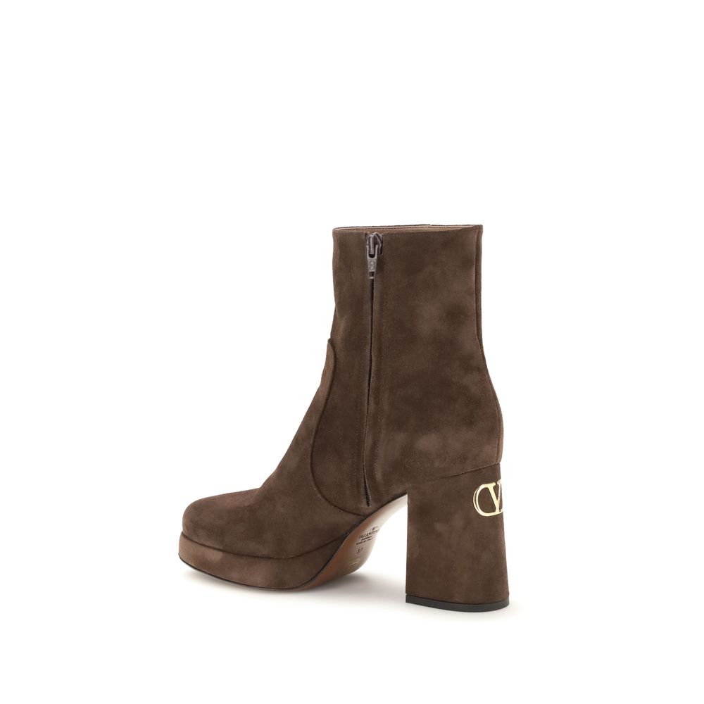 Platform Ankle Boots by Valentino Garavani for women in bos taurus calf suede leather brown, gold & signature features an avant-garde V Logo Women's Bos Taurus Calf Suede Leather Platform Ankle Boots silhouette, defined by a sophisticated platform block-heel and a avant-garde .