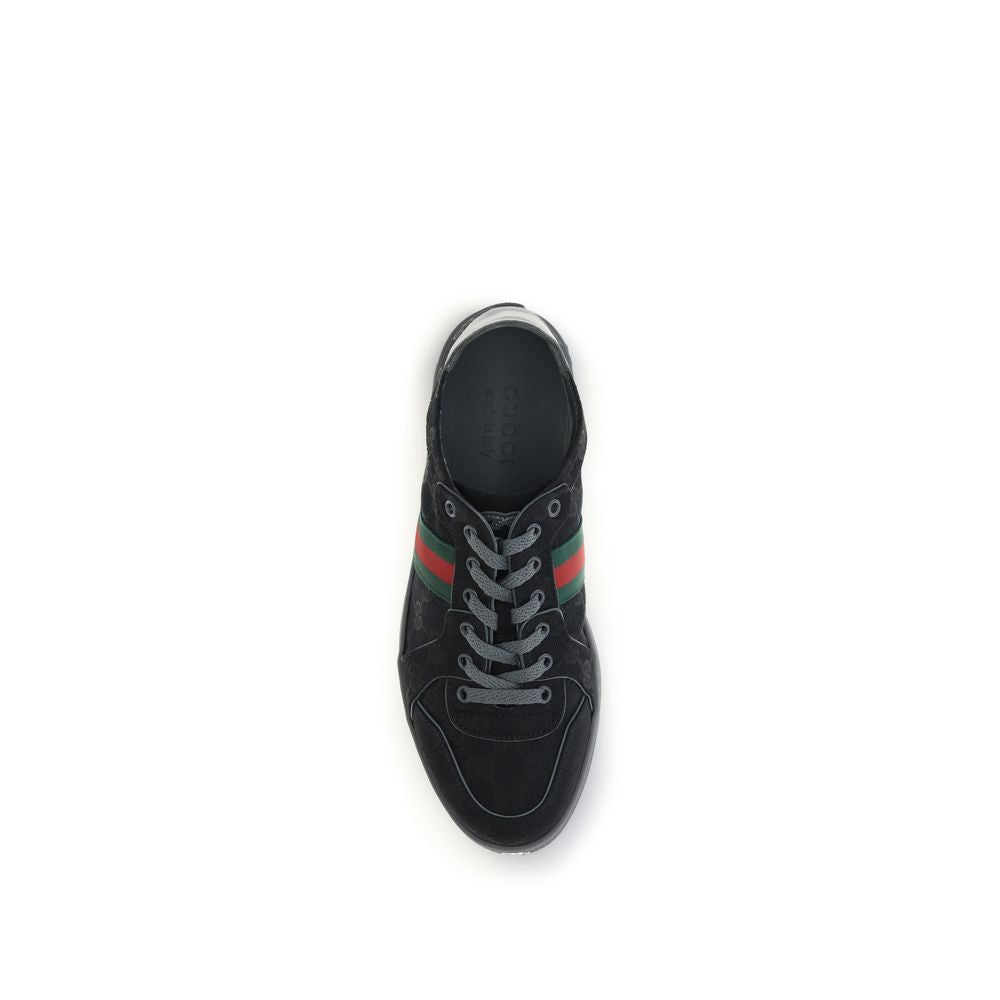 Athletic Sneakers by Gucci for men in rubber & fabric black, signature & striped presents a sleek silhouette, perfectly capturing the athletic style essence of Gg Men's Athletic Rubber & Fabric Sneakers with its sleek design and premium finish.