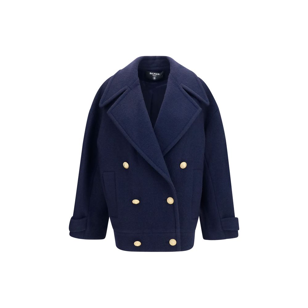 Overcoat by Balmain for women in merino wool blue & gold showcases a enveloping silhouette, detailed with distinctive and a enveloping v-neck lapel peak-lapel neckline.