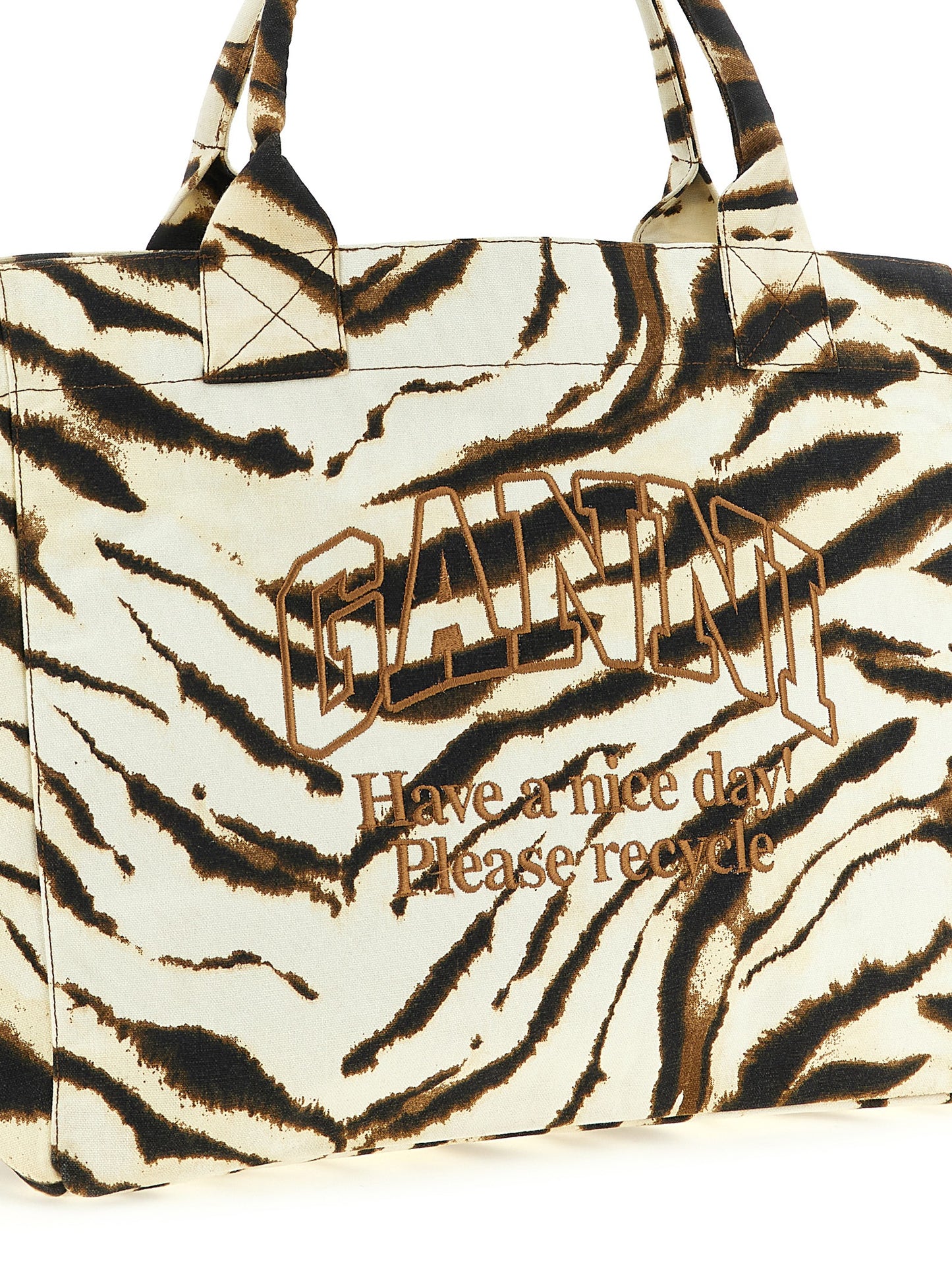 Shopper Tote Bag by Ganni for women in cotton beige, brown, zebra & print features a jet-set Cotton Shopper Tote Bag design, complete with a secure , ample , and versatile handle for a jet-set look.