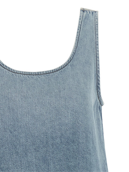 Dress by Ganni for women in organic cotton denim light-blue & signature features a dramatic silhouette, showcasing an elegant round neckline and that flows into a dramatic short mini.