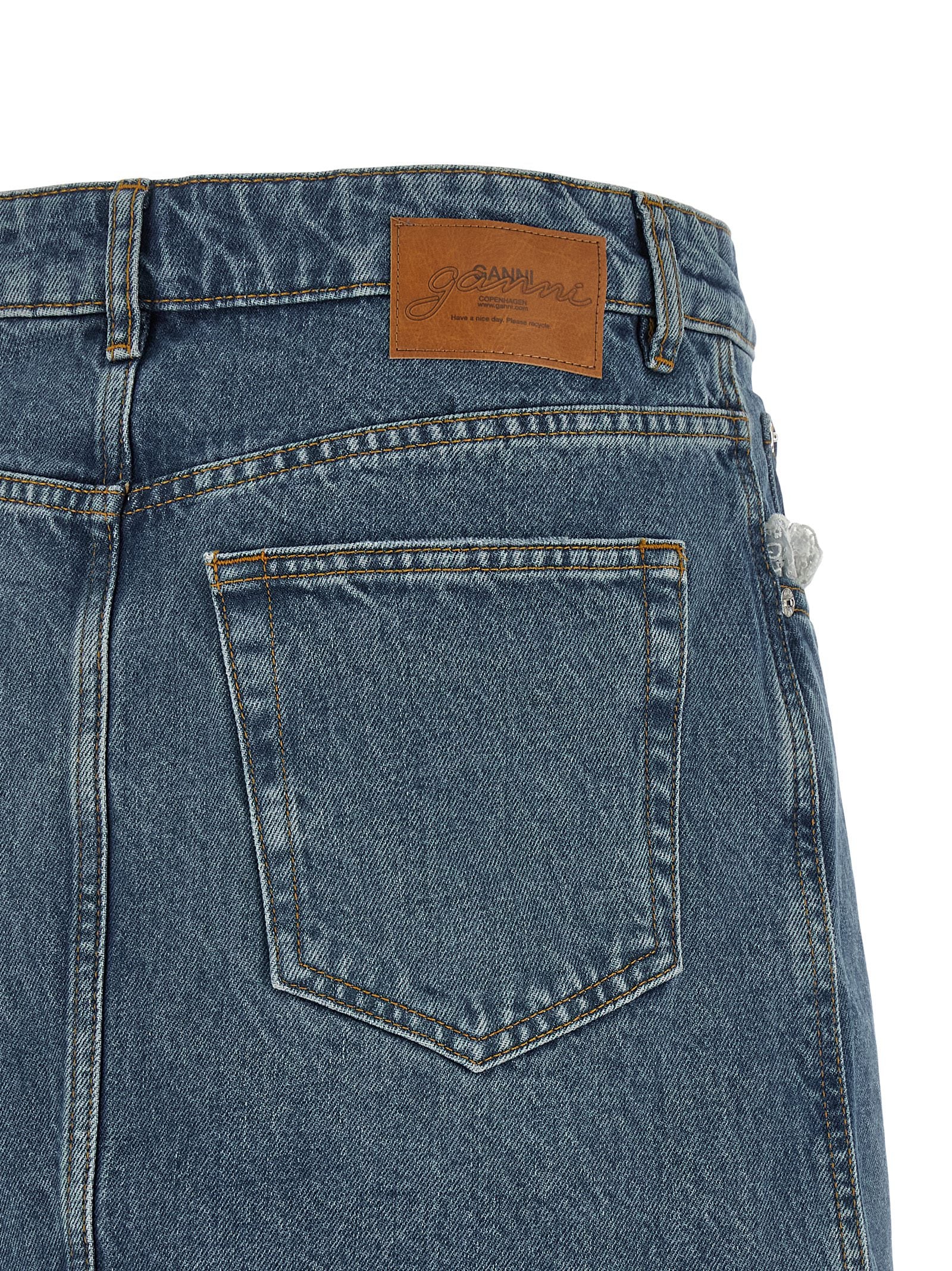 Skirt by Ganni for women in denim cotton blue, brown & white features a captivating silhouette, showcasing the captivating Women's Denim Cotton Skirt design with a sophisticated mini long for a captivating look.