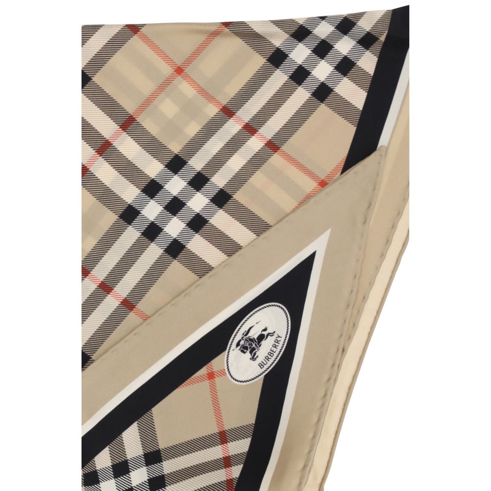 Scarf by Burberry for women in silk twill beige & patterned showcases a warm silhouette from the Silk Twill Scarf collection, offering a warm drape that exudes sophisticated luxury.