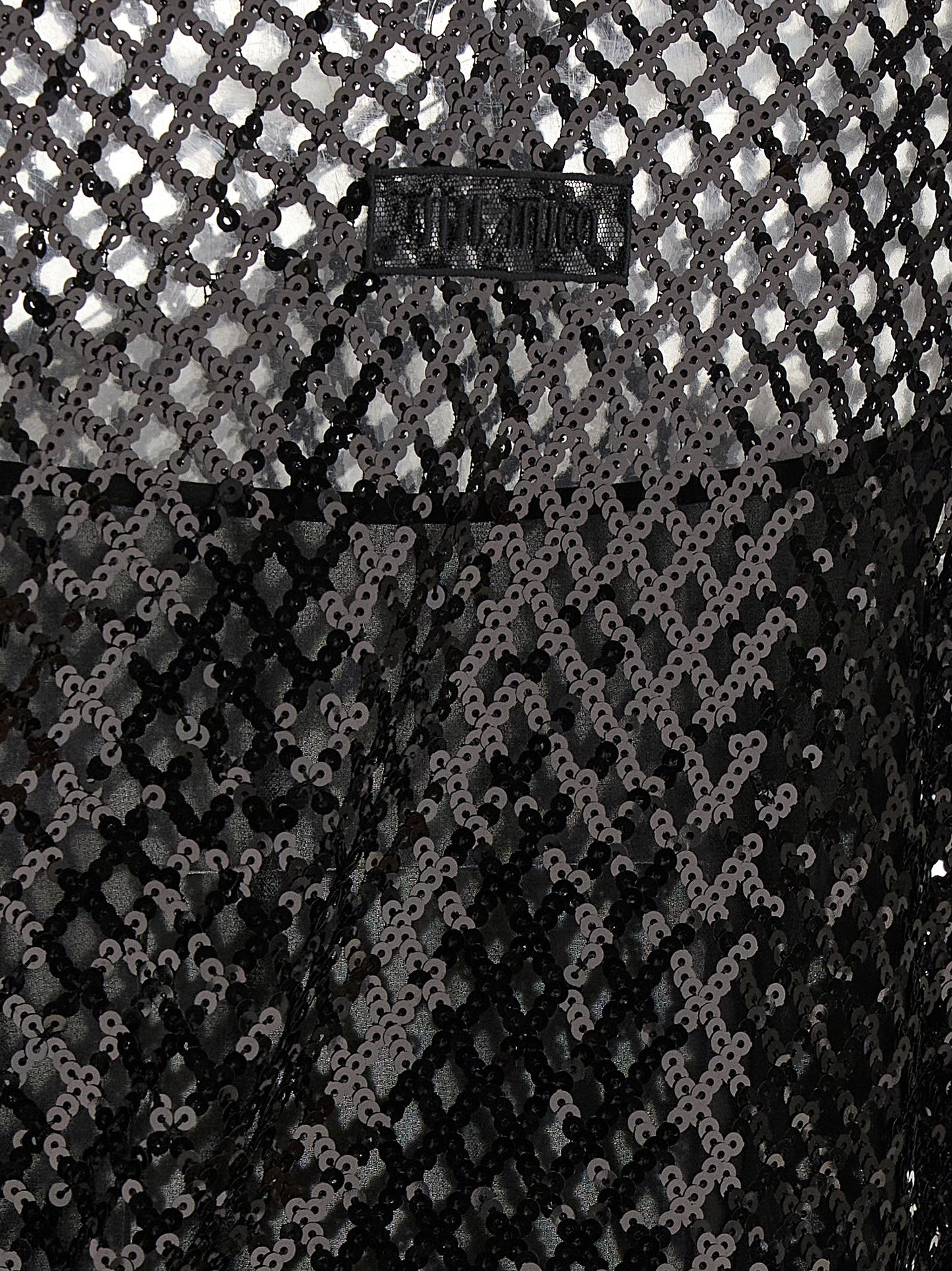Dress by The Attico for women in polyester sequins black & transparent features an eye catching silhouette with a sophisticated , elegant , and a refined short mini for a eye catching aesthetic.
