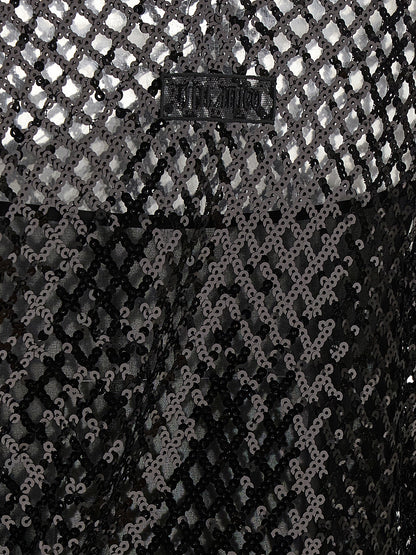 Dress by The Attico for women in polyester sequins black & transparent features an eye catching silhouette with a sophisticated , elegant , and a refined short mini for a eye catching aesthetic.