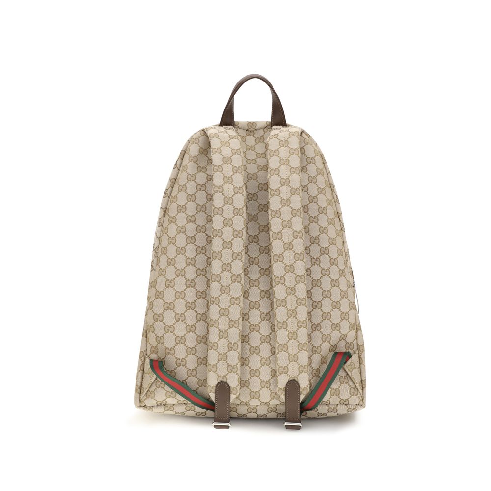 Large Travel Backpack by Gucci for men in polyamide polyester leather & cotton canvas beige, green, red, silver & striped showcases an architectural Gg Polyamide Polyester Leather & Cotton Canvas Large Travel Backpack design, featuring a secure zipper, ample laptop-compartment, and architectural backpack-strap & adjustable-strap for a sophisticated look.