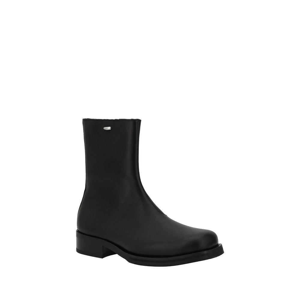 Ankle Winter Boots by Our Legacy for men in bos taurus calf leather black showcases a ergonomic silhouette from the Men's Bos Taurus Calf Leather Ankle Winter Boots collection, featuring a ergonomic block-heel and a ergonomic .