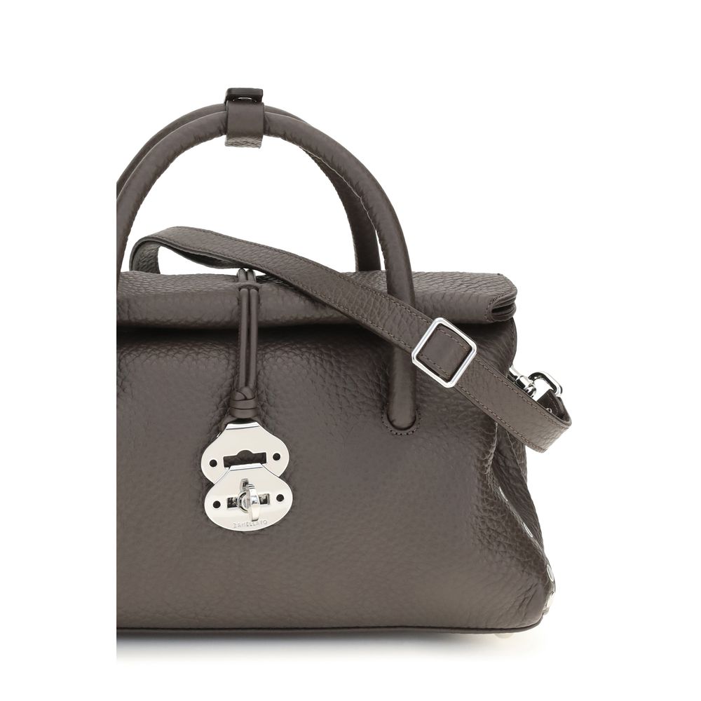 Shoulder Bag by Zanellato for women in bos taurus calf leather brown showcases a enviable silhouette, artfully detailed with a secure hook, organized built-in-compartments, and versatile shoulder-strap, handle & adjustable-strap for a enviable look.