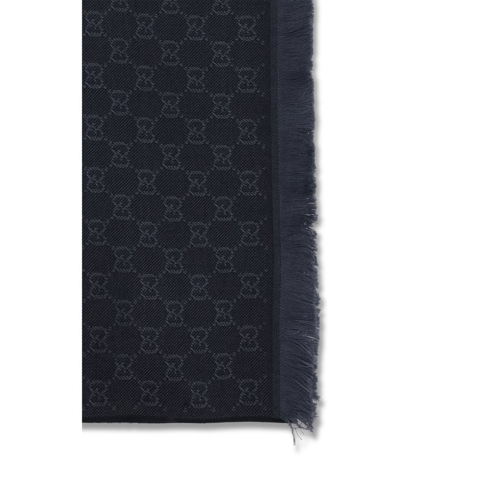 Scarf by Gucci for women in wool black showcases a warm silhouette from the Gg Wool Frayed-Edge Scarf collection, offering a warm drape that exudes sophisticated luxury.