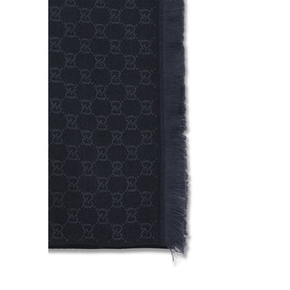 Scarf by Gucci for women in wool black showcases a warm silhouette from the Gg Wool Frayed-Edge Scarf collection, offering a warm drape that exudes sophisticated luxury.