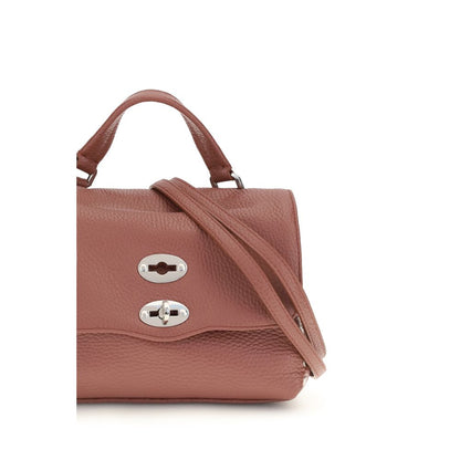 This Handbag by Zanellato for women in bos taurus calf leather and multicolor presents a sculptural silhouette featuring a secure zipper, ample , and versatile shoulder-strap, handle & adjustable-strap for a sculptural finish.