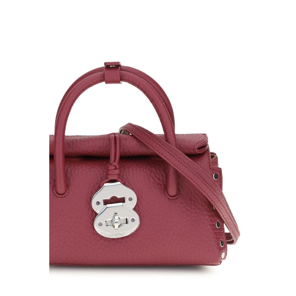 Handbag by Zanellato for women in bos taurus calf leather multicolor features a refined silhouette, showcasing a secure magnetic, buckle & roll-top, organized , and versatile shoulder-strap & adjustable-strap for a refined finish.