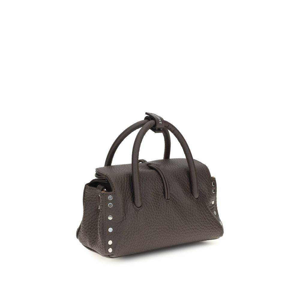 Handbag by Zanellato for women in bos taurus calf leather brown features a contemporary silhouette, showcasing a secure magnetic, buckle & roll-top, ample , and contemporary shoulder-strap & adjustable-strap for a sophisticated look.