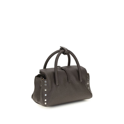 Handbag by Zanellato for women in bos taurus calf leather brown features a contemporary silhouette, showcasing a secure magnetic, buckle & roll-top, ample , and contemporary shoulder-strap & adjustable-strap for a sophisticated look.