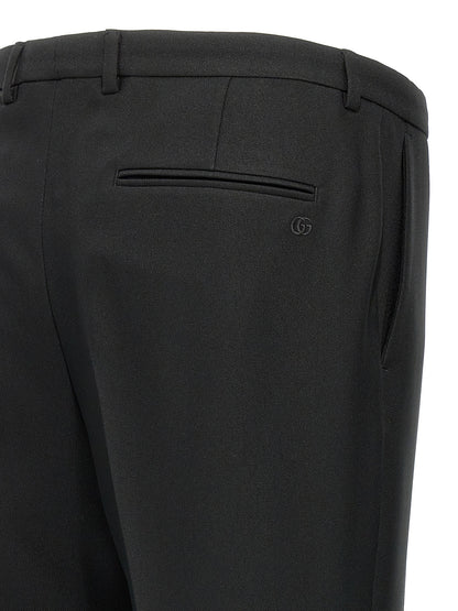 Casual Pants by Gucci for men in polyester twill black features a polished silhouette with a polished , reaching a polished long and finished with a polished .