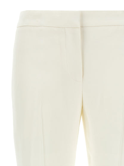 Casual Pants by Alexander McQueen for women in acetate crepe & viscose white features a refined silhouette with a refined straight, defined by a mid rise and a refined long for a refined finish.