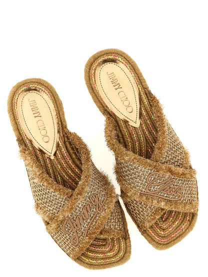 Sliders Sandals Flat Shoes by Jimmy Choo for women in lurex gold presents a effortless chic silhouette, showcasing the Women's Lurex Sliders Sandals Flat Shoes design with a effortless chic and square toe style for a sophisticated look.