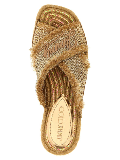 Sliders Sandals Flat Shoes by Jimmy Choo for women in lurex gold showcases a enchanting silhouette as part of the Women's Lurex Sliders Sandals Flat Shoes collection, defined by a enchanting square toe style and for a enchanting look.