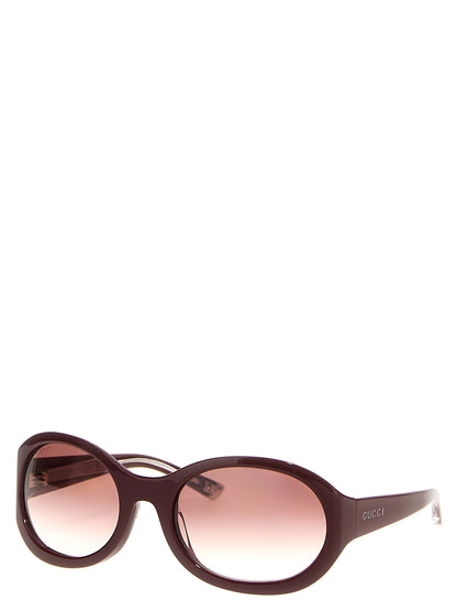 This Sunglasses by Gucci for women in bos taurus calf suede leather gradient & bordeaux presents a sumptuous silhouette, showcasing a sumptuous round frame design in and high-performance gradient lens.