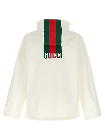 Hooded Windbreaker Jacket by Gucci for men in cotton white & print showcases a modern silhouette, integrating pockets, hooded & windproof and a modern hooded neckline for a sophisticated finish.