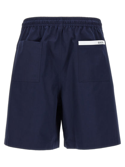 Bermuda Shorts by Gucci for men in cotton blue & signature features an nuanced silhouette, showcasing a nuanced relaxed-fit with a short cut and for a sophisticated, premium finish.