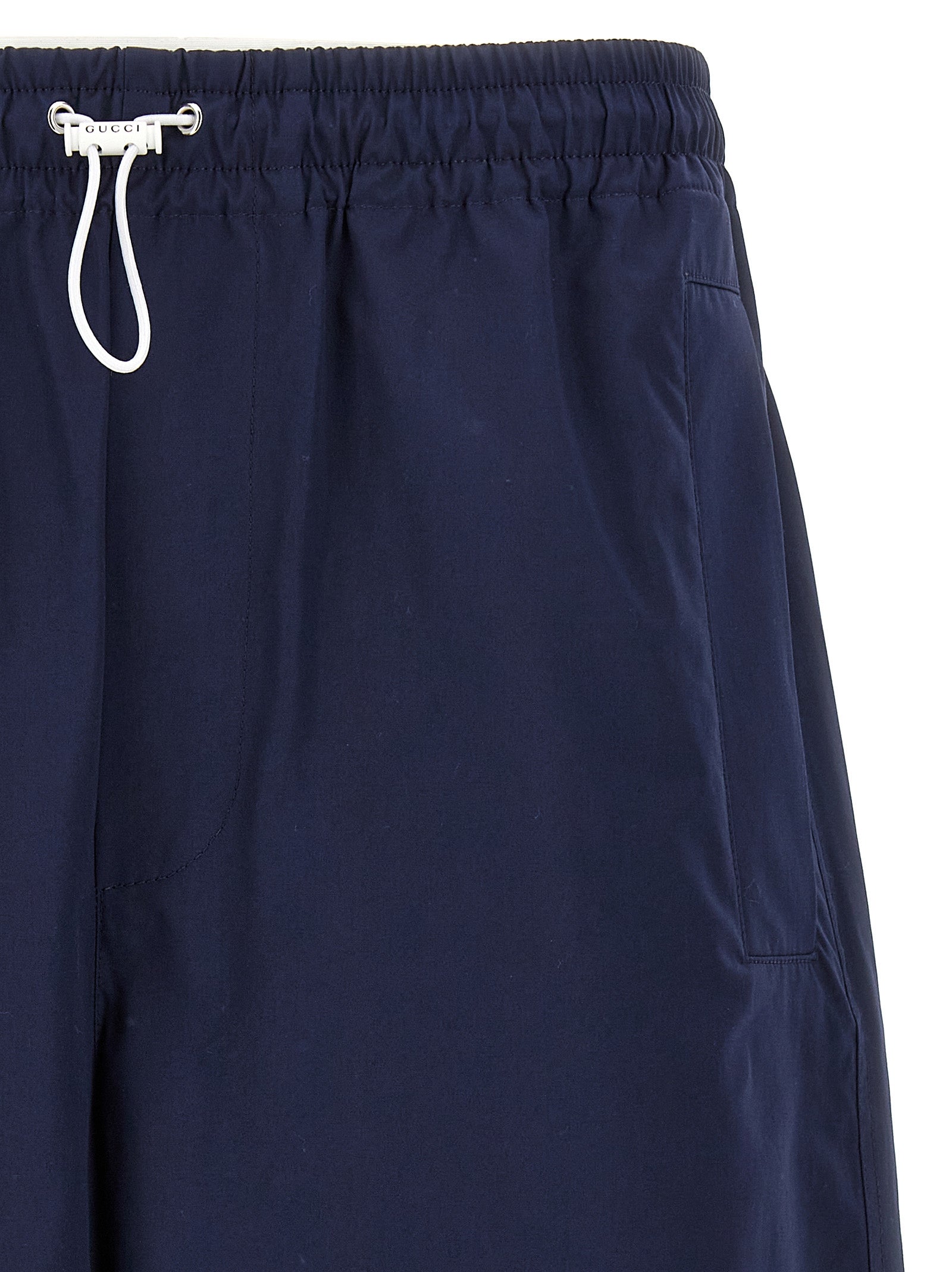Bermuda Shorts by Gucci for men in cotton blue & signature presents a contemporary silhouette, showcasing a contemporary relaxed-fit with a refined short and elegant .