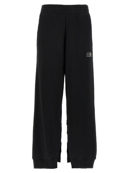 Joggers by MM6 Maison Margiela for women in cotton black, white, signature & print features a refined silhouette with a refined wide, defined by a high rise and a refined long for a refined finish.